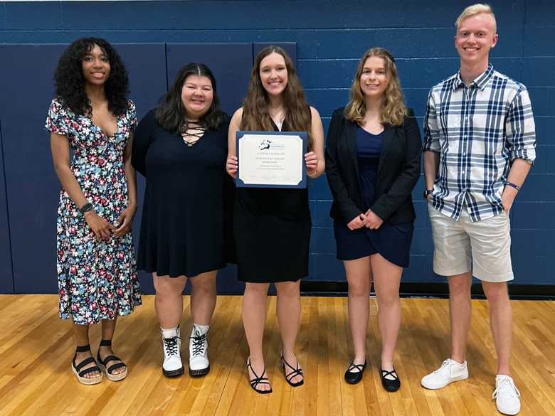 Male and Female SGA students posing with award certificate